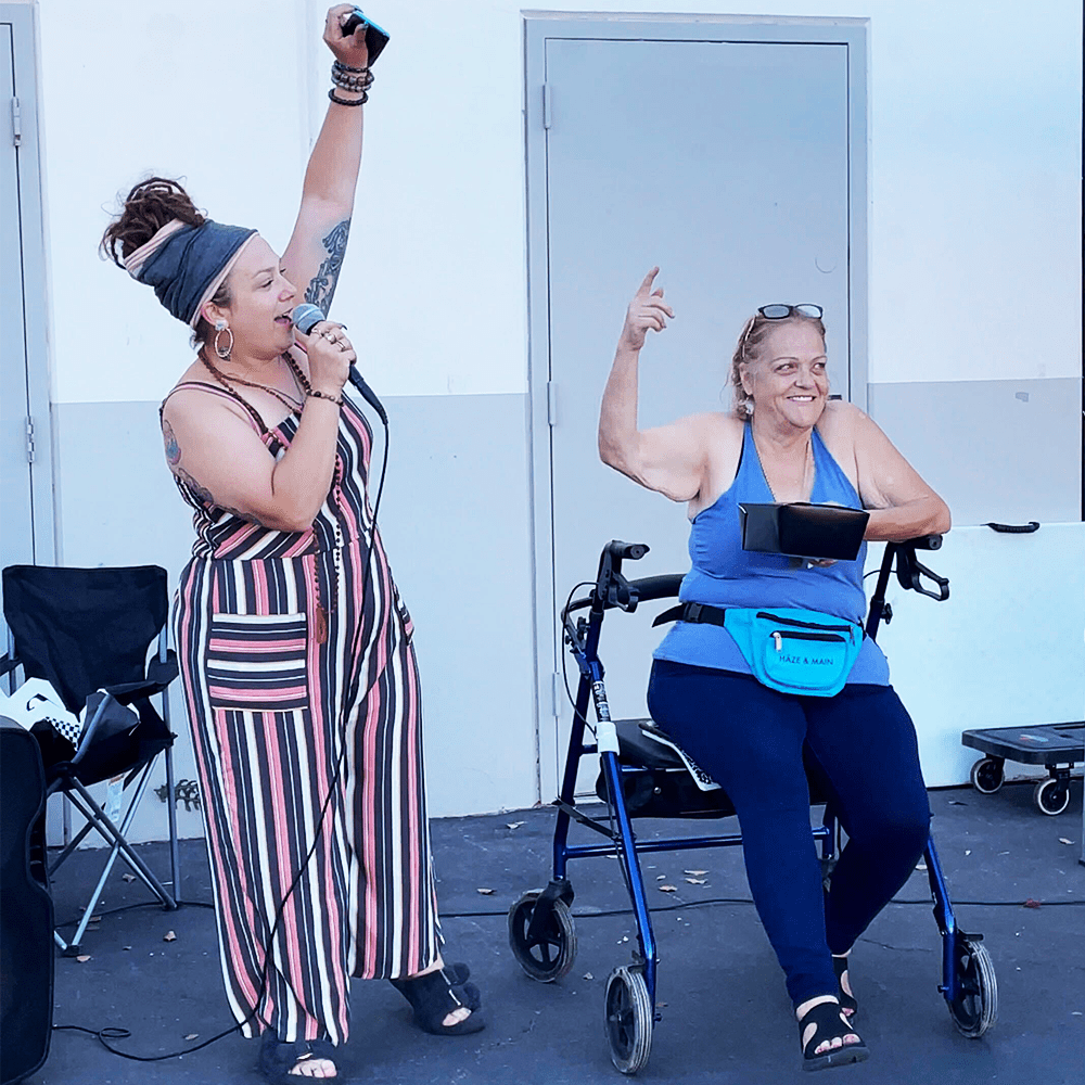 Two members of Tom's Palms celebrating a successful event